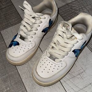 White Nike air forces with butterfly stickers